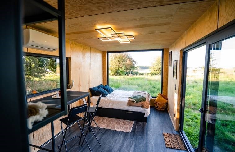 Tiny House met zicht op schapen en alpaca's