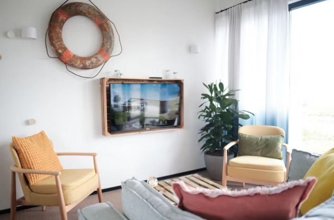 Kleurrijke Lodge in de duinen op 500 meter van zee