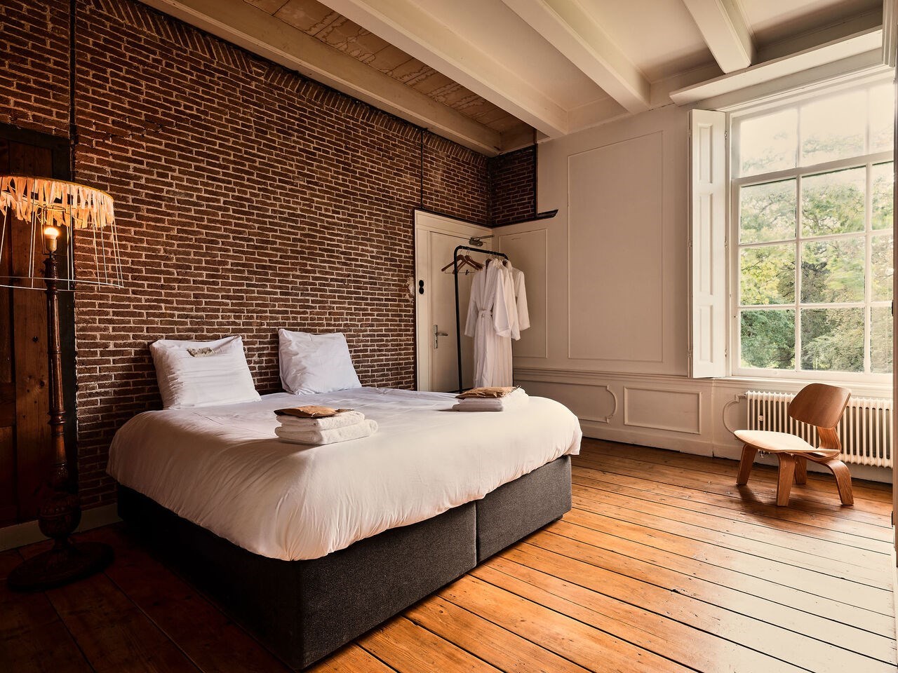 Familiekamer met uitzicht op het park van een prachtige buitenplaats